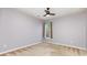 Bedroom with neutral walls, neutral carpet, a ceiling fan and a window with natural light at 10198 Tintinhull Dr, Fort Mill, SC 29707