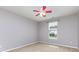 Comfortable bedroom featuring a ceiling fan, a window, and carpeted floors at 10198 Tintinhull Dr, Fort Mill, SC 29707