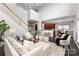 Open living space with elegant staircase, contemporary furniture, and an open flow to the kitchen and dining area at 10198 Tintinhull Dr, Fort Mill, SC 29707