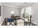 Bright home office space with natural light, a writing desk, and comfortable seating perfect for remote work at 10198 Tintinhull Dr, Fort Mill, SC 29707