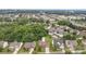 Aerial view of home showcasing landscaped yard, neighborhood, and surrounding greenery at 10198 Tintinhull Dr, Indian Land, SC 29707