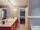 Bright bathroom with a double vanity and ample counter space offers a convenient design, next to the main bedroom at 1060 S Lentz Harness Shop Rd, Mount Pleasant, NC 28124