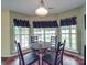 Bright breakfast area with windows and table at 1060 S Lentz Harness Shop Rd, Mount Pleasant, NC 28124