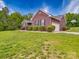 Beautiful exterior of the home featuring a well-manicured lawn and garage at 1060 S Lentz Harness Shop Rd, Mount Pleasant, NC 28124