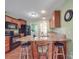 Modern kitchen featuring a breakfast bar with seating, stainless steel appliances, and ample counter space at 1060 S Lentz Harness Shop Rd, Mount Pleasant, NC 28124