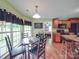 Cozy breakfast nook with a round table and seating, connected to the kitchen with natural lighting at 1060 S Lentz Harness Shop Rd, Mount Pleasant, NC 28124