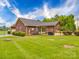 View of a beautiful home featuring a large backyard and covered patio at 1060 S Lentz Harness Shop Rd, Mount Pleasant, NC 28124