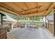 The back deck has a cozy seating area and overlooks a well-manicured yard at 1119 Thornsby Ln, Matthews, NC 28105