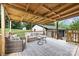 Comfortable back deck with seating, offering a relaxing outdoor space overlooking the lawn at 1119 Thornsby Ln, Matthews, NC 28105