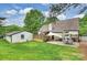 Expansive backyard includes a patio, wooden deck, storage shed, and a well-maintained lawn at 1119 Thornsby Ln, Matthews, NC 28105