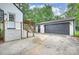 Exterior view of home featuring backyard, deck, garage, and driveway at 1119 Thornsby Ln, Matthews, NC 28105