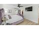 Stylish bedroom featuring a TV, ceiling fan, and a walk-in closet at 1119 Thornsby Ln, Matthews, NC 28105