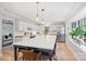 Bright kitchen with island seating, stainless appliances, and butcher block countertops at 1119 Thornsby Ln, Matthews, NC 28105