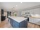 Bright kitchen featuring a large island with seating and storage and stainless steel appliances at 1119 Thornsby Ln, Matthews, NC 28105