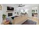 Bright living room featuring a fireplace, flatscreen TV, and doors to an outdoor deck at 1119 Thornsby Ln, Matthews, NC 28105