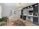 Elegant living room with a bar area, hardwood floors, and an open layout at 1119 Thornsby Ln, Matthews, NC 28105