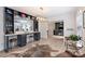 Stylish living room with a custom bar area, hardwood floors, and modern decor at 1119 Thornsby Ln, Matthews, NC 28105