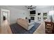 Comfortable living room featuring a ceiling fan, fireplace, and sliding doors to the deck at 1119 Thornsby Ln, Matthews, NC 28105