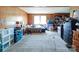 A cozy bedroom with wood walls, carpet flooring, and natural light, offering a versatile space at 121 Patrick St, Gastonia, NC 28054