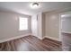 Cozy bedroom featuring vinyl plank flooring, a window, and a closet at 121 Patrick St, Gastonia, NC 28054