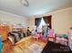 Cozy bedroom with toys, window, and space for a small  at 121 Patrick St, Gastonia, NC 28054