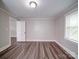 Bedroom with a window and hardwood-style flooring at 121 Patrick St, Gastonia, NC 28054