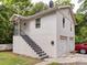 Exterior view of the home showing a two-car garage and stairway at 121 Patrick St, Gastonia, NC 28054