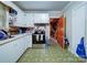 Functional kitchen featuring white cabinetry, stainless steel appliances, and tile flooring at 121 Patrick St, Gastonia, NC 28054
