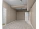 Finished basement space with neutral carpeting and paint, ready for your personal touches and design at 1369 Timberlane Ter, Mooresville, NC 28115