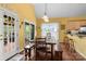 Eat-in kitchen offers a spacious dining area with a large wooden table and benches, and an adjacent outdoor patio at 1369 Timberlane Ter, Mooresville, NC 28115
