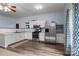 Modern kitchen with stainless steel appliances, granite countertops, and ample cabinet space at 1369 Timberlane Ter, Mooresville, NC 28115