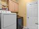 This laundry room features new appliances and plenty of storage space with cabinets and shelves at 1369 Timberlane Ter, Mooresville, NC 28115