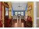 Inviting foyer leads to a living room featuring a vaulted ceiling, hardwood floors, and tastefully appointed furnishings at 1369 Timberlane Ter, Mooresville, NC 28115