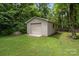 Exterior image of large outbuilding with overhead door, neutral siding, and a lawn at 1369 Timberlane Ter, Mooresville, NC 28115