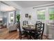 Charming dining area featuring a round table with black chairs and views into the sunny living room at 143 Hallman St, Cherryville, NC 28021
