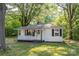Cozy one-story home featuring a covered porch and traditional architectural details at 143 Hallman St, Cherryville, NC 28021