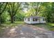 Charming single-story home featuring a landscaped yard and a welcoming front porch at 143 Hallman St, Cherryville, NC 28021