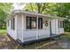 Attractive one-story home showcasing a covered porch and black window frames at 143 Hallman St, Cherryville, NC 28021