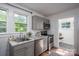 Well-lit kitchen with modern appliances, stylish countertops, and a cozy layout that optimizes space and functionality at 143 Hallman St, Cherryville, NC 28021