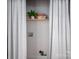 A compact laundry area discreetly concealed behind a stylish curtain, maximizing space and functionality at 143 Hallman St, Cherryville, NC 28021