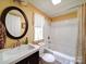 Bathroom with shower-tub combo, and dark wood vanity with sink at 157 Old Hearth Rd, Clover, SC 29710