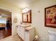 Bathroom featuring a vanity with storage, an framed mirror and tiled floors at 157 Old Hearth Rd, Clover, SC 29710