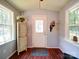 Bright foyer with hardwood floors, natural light, and a coat rack for convenience at 157 Old Hearth Rd, Clover, SC 29710
