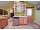 Kitchenette area with a small sink, white cabinets, and wooden floors, offering convenient amenities at 157 Old Hearth Rd, Clover, SC 29710
