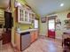 Kitchenette area with a small sink, white cabinets, and wooden floors, offering convenient amenities at 157 Old Hearth Rd, Clover, SC 29710
