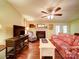 Cozy living room featuring a fireplace, television and comfortable seating. French doors to the yard at 157 Old Hearth Rd, Clover, SC 29710