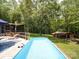 Beautiful in-ground pool with a spacious wood deck, perfect for outdoor entertaining and relaxation at 157 Old Hearth Rd, Clover, SC 29710