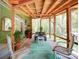 Open screened porch with wood ceilings and flooring, and peaceful backyard views at 157 Old Hearth Rd, Clover, SC 29710