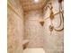 Close up of tiled shower with built-in corner seat and adjustable shower head at 157 Old Hearth Rd, Clover, SC 29710