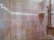 Tiled shower stall with decorative accents, providing a luxurious and stylish bathing experience at 157 Old Hearth Rd, Clover, SC 29710